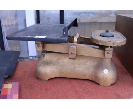 A PAIR OF VINTAGE CAST IRON BALANCE SCALES