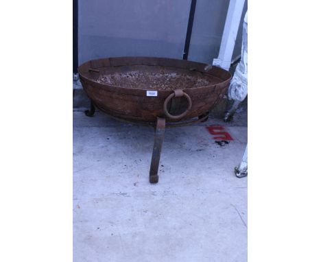 A VINTAGE METAL FIRE PIT WITH TRIPOD STAND