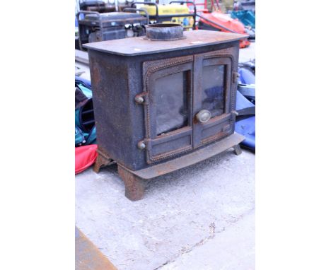 A VINTAGE CAST IRON LOG BURNER