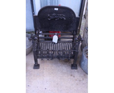 A DECORATIVE CAST IRON FIRE GRATE WITH BACK