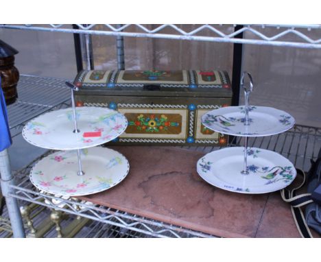 A DECORATIVE PAINTED METAL BOX AND TWO CERAMIC CAKE STANDS