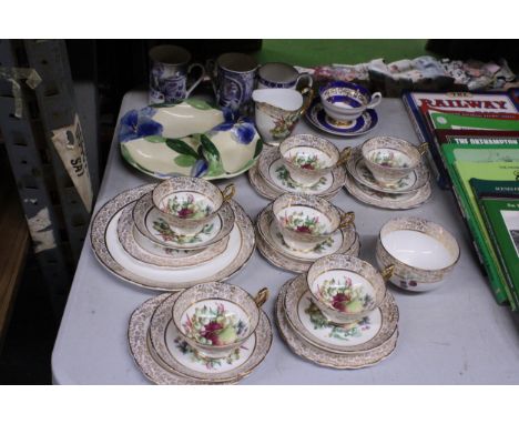 A QUANTITY OF VINTAGE FLORAL AND FRUIT PATTERNED TEA CUPS, SAUCERS AND PLATES TOGETHER WITH TWO BLUE AND WHITE CHINA MUGS ETC
