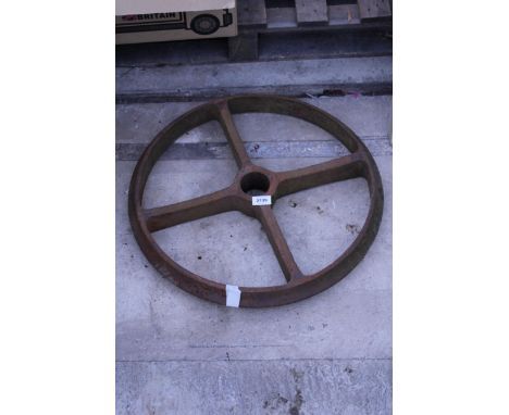 A VINTAGE CAST IRON RAILWAY WHEEL