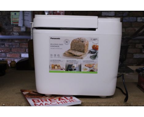 AN AS NEW PANASONIC AUTOMATIC BREAD MAKER, MODEL NO. SD-B2510, WITH INSTRUCTIONS AND A BREAD COOKERY BOOK - VENDOR STATES NEV