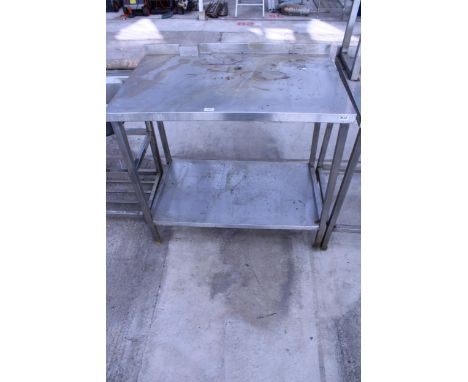 A STAINLESS STEEL KITCHEN UNIT WITH LOWER SHELF