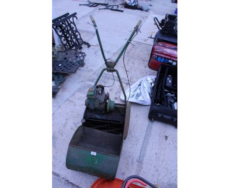 A VINTAGE PETROL ENGINE CYLINDER MOWER WITH GRASS BOX