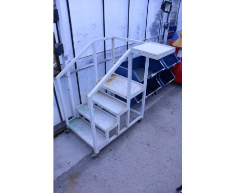 A LARGE METAL FOUR STEP DECORATORS PLATFORM