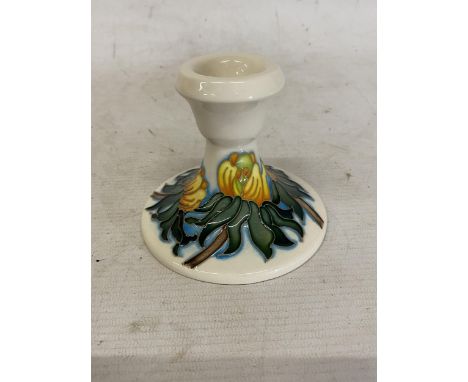 A MOORCROFT CANDLESTICK WINTER ACONITE PATTERN
