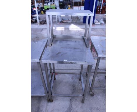 A STAINLESS STEEL KITCHEN UNIT WITH UPPER SHELF