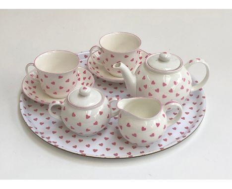 A Nina Campbell pink heart china tea set for two comprising teacups, saucers, teapot, milk jug, sugar bowl and tray 