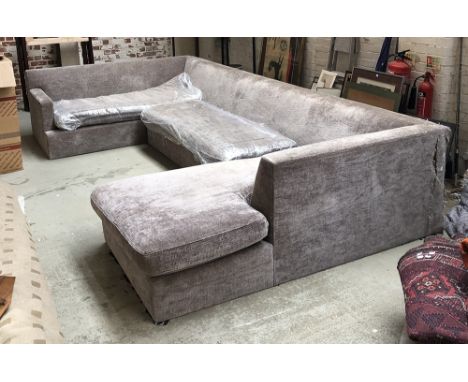 A very large grey U shaped sofa, approx. 397x196x74cmH excluding wooden base made by Interior Workshops, London