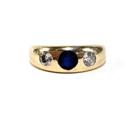 A gold gypsy ring set with diamonds and a central sapphire, marks rubbed but tests as 14ct or higher, total diamond carat app