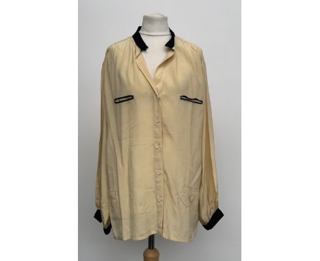 A Scali Paris size 42 silk blouse in apricot with black cuff and collar detail 