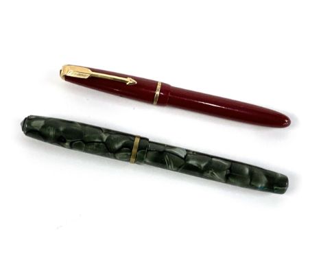A Burnham B48 fountain pen with B45 fine nib; together with a Parker pen 