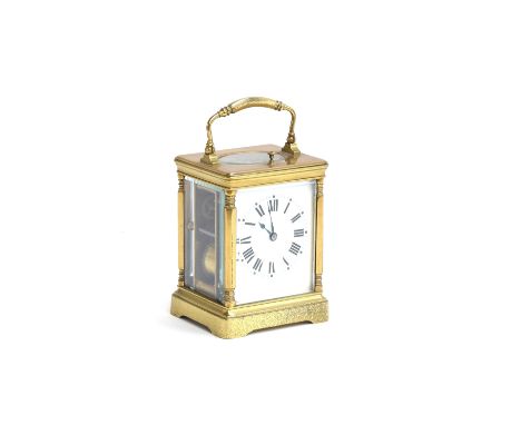 A 19th century French brass repeater carriage clock, the white enamel dial with Roman numerals, 12cm high excluding handle 