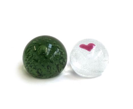 A Whitefriars style green glass paperweight together with a Caithness 'Sweetheart' glass paperweight, each approx. 6cmH (2) 
