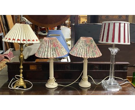 A pair of white porcelain table lamps with floral shades, 45cmH overall, a lucite column table lamp with red and white stripe