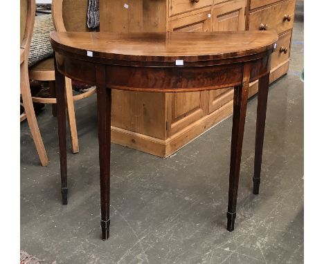 A George III mahogany and crossbanded card table, square tapered legs af, 91x46x75cmH 