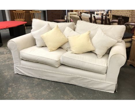 A modern country house sofa with cream loose cover, 205cmW 