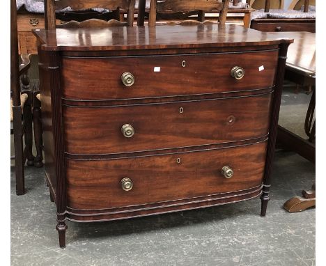 Lot - An antique banded walnut chest the broadly cross banded moulded top  over three banded graduated drawers with pierced cross escutcheo