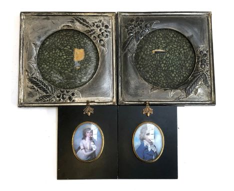 Two miniature portrait frames, 14.5x12cm overall; together with two white metal picture frames with berry design 