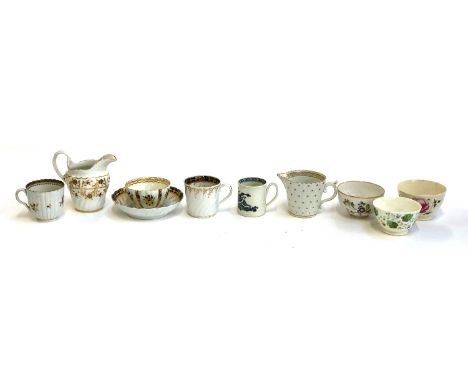 A small collection of 18th and 19th century teacups, saucers and milk jugs, jug with Worcester crescent mark, one teabowl flo