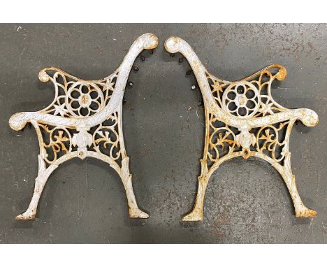 Two cast iron garden bench ends, 71cmH 