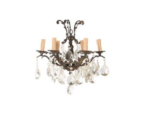 A late 19th/early 20th century gilt metal and facetted glass chandelier, of bag form with drops and swags 45cm high, 33cm wid