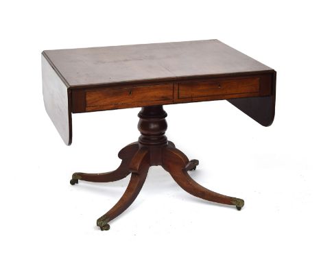 A William IV mahogany sofa table, on a turned column and four swept legs with acanthus caps and brass casters, 93cm wide when