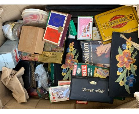 A box of various vintage card games, gaming tokens, bridge scoring pads, puzzles etc 