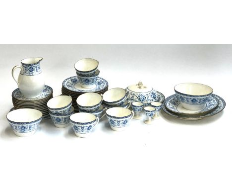 A Wedgwood part tea service comprising teacups, saucers, muffin dish, sugar bowl etc 