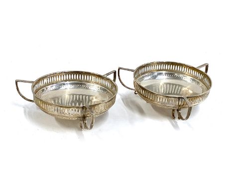 A pair of George V silver tri-handled bonbon dishes, William Hutton &amp; Sons, Birmingham 1915, each 10cm diameter, 4.6ozt 