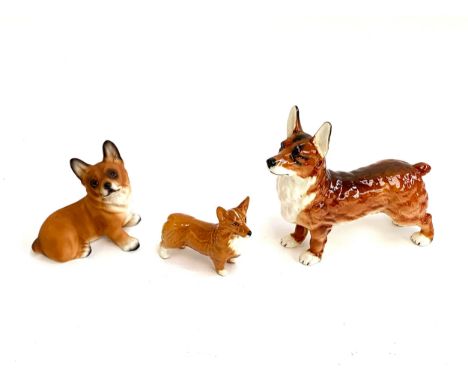 A Beswick corgi; together with a Goebel corgi and one other (3)