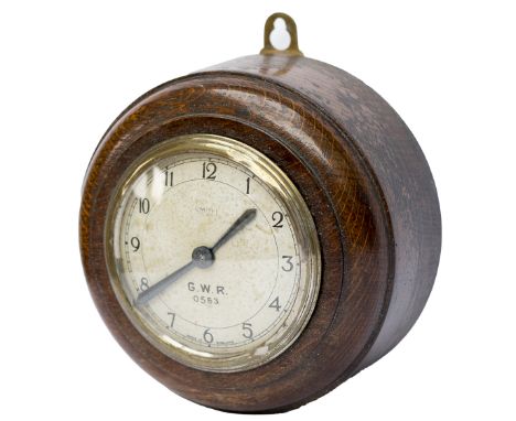 GWR oak cased Pork Pie wall clock with an English Smiths movement and the dial marked GWR 0553. Measures 6in diameter overall