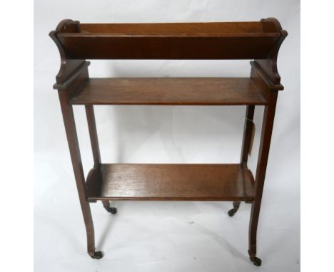 An early 20th century oak two tier book trough, H.77 W.55 D.22cm 