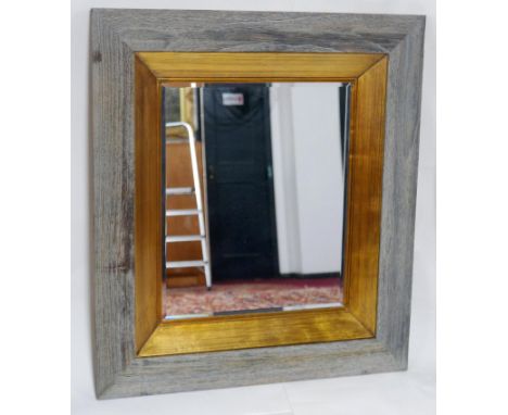 A contemporary mirror with bevelled plate, 94 x 84cm 
