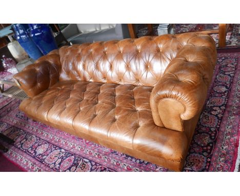 A John Lewis tan leather chesterfield sofa 