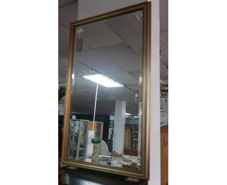 A gilt framed mirror with bevelled plate, 132 x 79cm 