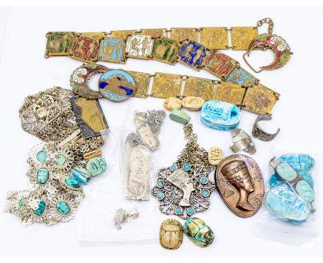 A collection of Egyptian themed jewellery to include white metal pendants and earrings, base metal pendants, bracelets, neckl