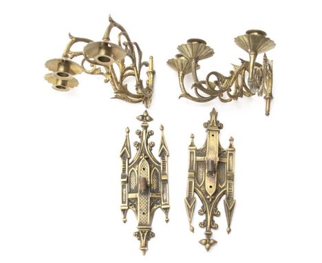 A pair of Victorian brass wall lights, Gothic Revival plates with detachable scrolling three light branches each with scallop