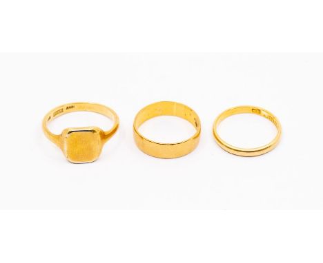 Two 22ct gold bands, widths approx 5mm and 2mm, sizes Q and P1/2, combined weight approx 6.9gms along with an 18ct gold signe