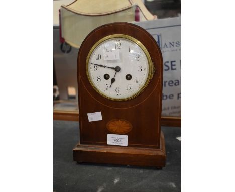 An Edwardian dome-shaped mahogany mantle clock with batwing inlay and Arabic numerals