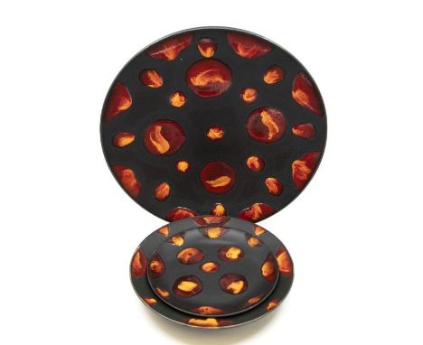 Collection of three pieces of Poole Pottery including a large boxed charger, a boxed plate and a larger plate (unboxed)