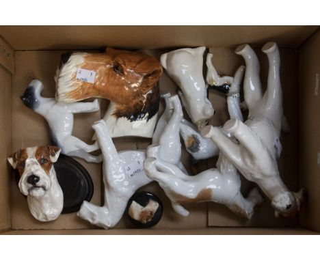 Collection of eleven ceramic wired hair fox terriers, by various factories including Royal Worcester, Crown Devon, Dresden, U