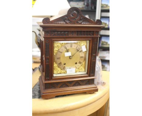 Late 19th Century mahogany mantle clock with glass panelled sides, silvered dial, Roman numerals, 8 day