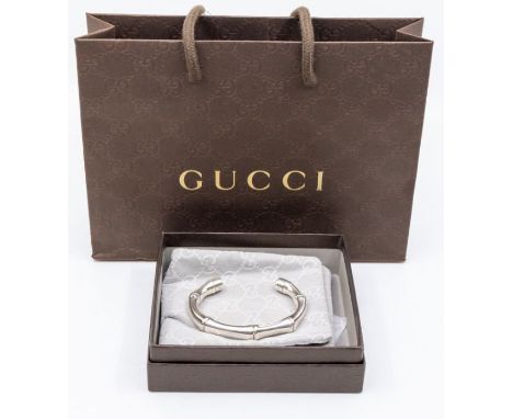 A silver Gucci torque bangle in the form of bamboo, width approx 10mm, internal diameter approx 65mm, marked to one terminal 