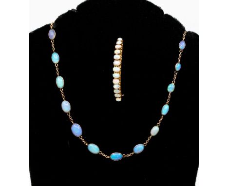 An early 20th Century opal necklace and yellow metal line necklace, comprising oval graduated opals optical set probably in 9