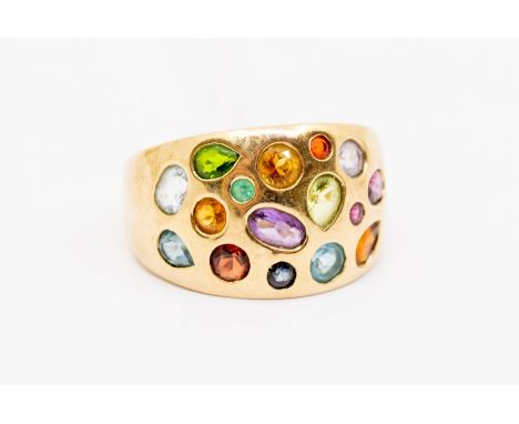 A 9ct gold and stone set ring, boule style set alternate various cuts and types of stone including, garnet, topaz, amethyst, 