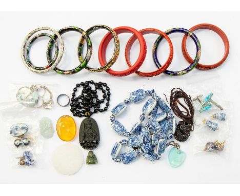 A collection of oriental costume jewellery to include enamel bangles, blue and white ceramic bead necklaces, earrings, brooch