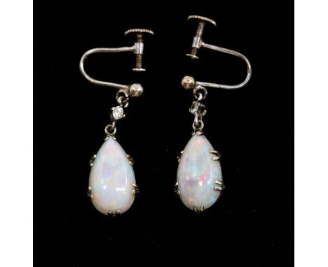 A pair of early 20th Century opal and white sapphire white metal drop earrings, comprising claw set pear shaped opals, size a